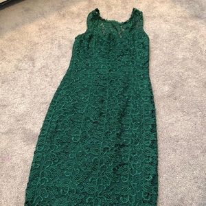 Green lace dress hits just below the knees